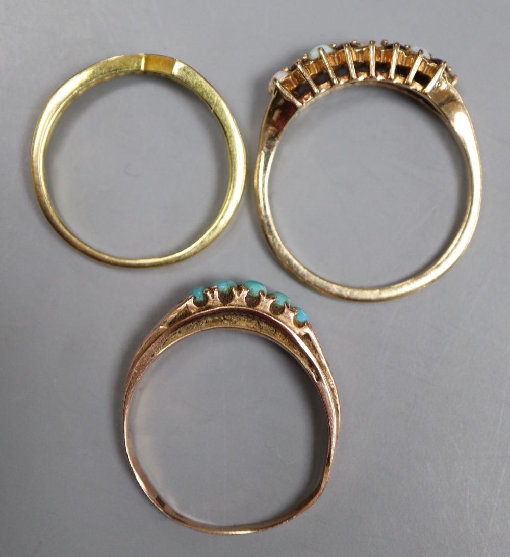 A modern 750 , sapphire and diamond set ring, gross 1.9 grams, and two other gem set rings including 9ct gold, gross 3.8 grams.